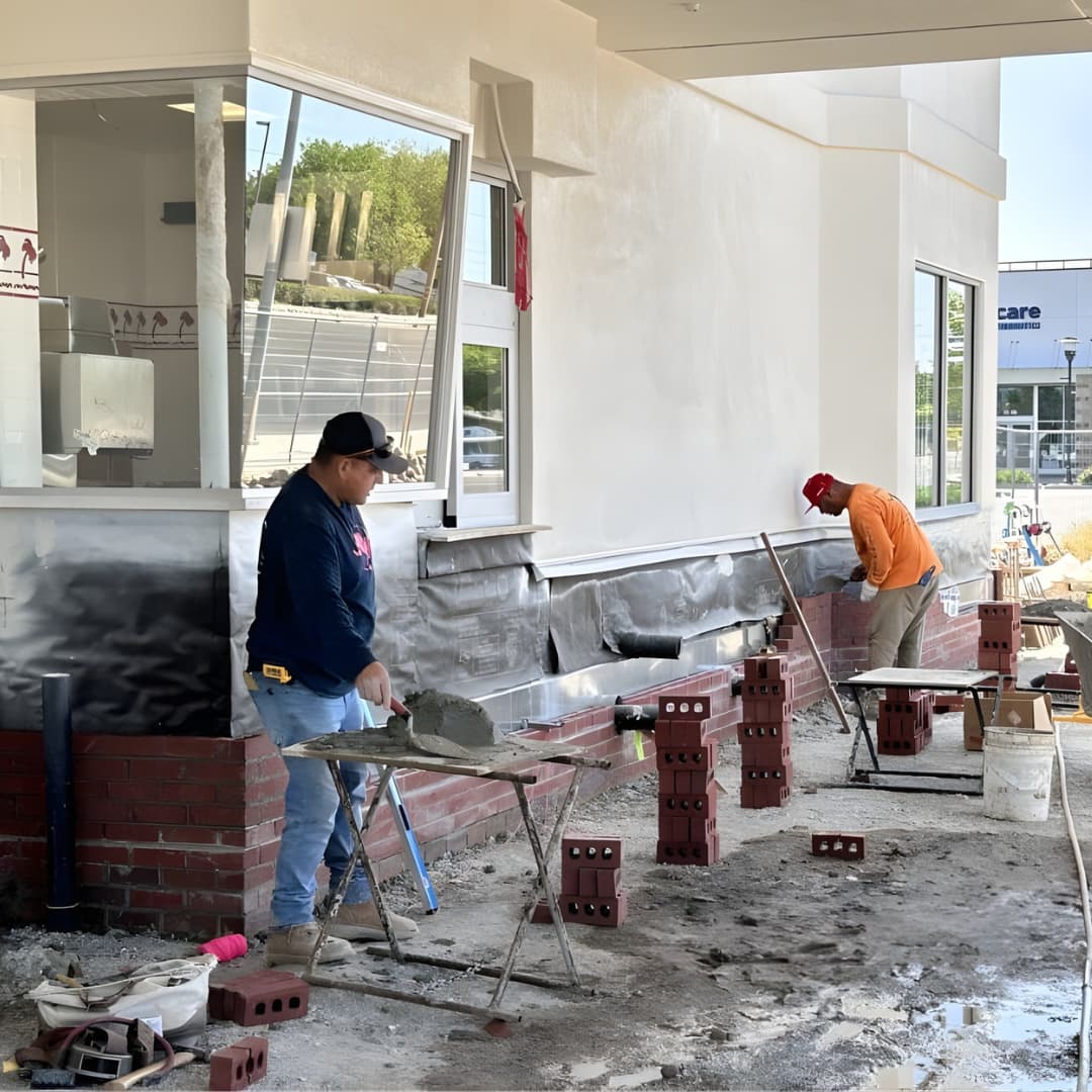 Cal Mantel masonry crew working on commercial exterior