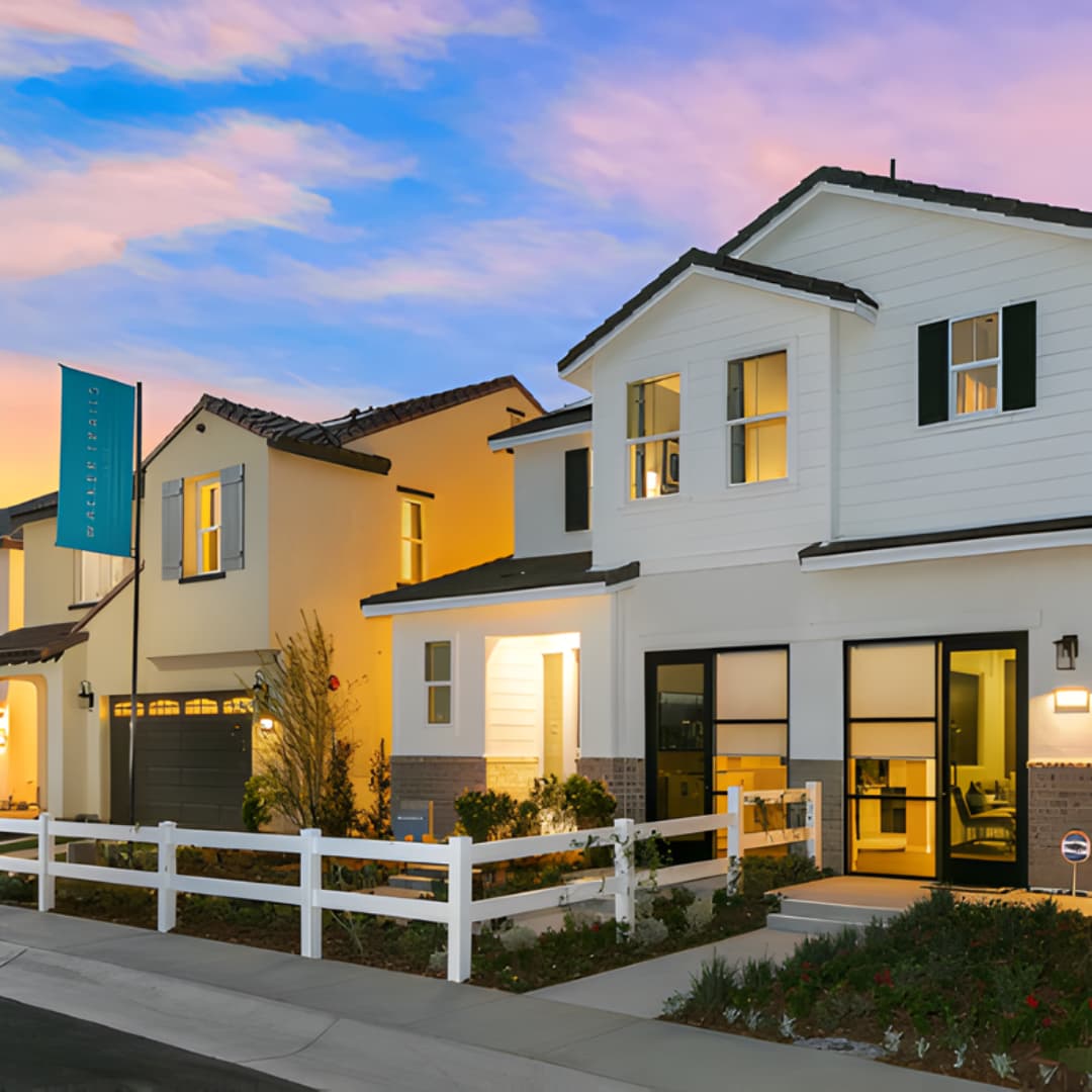 Row of contemporary white homes with dark roofs