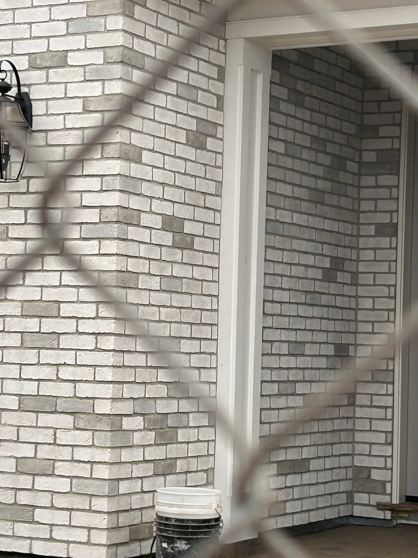 Brick veneer corner detail at a covered home entryway