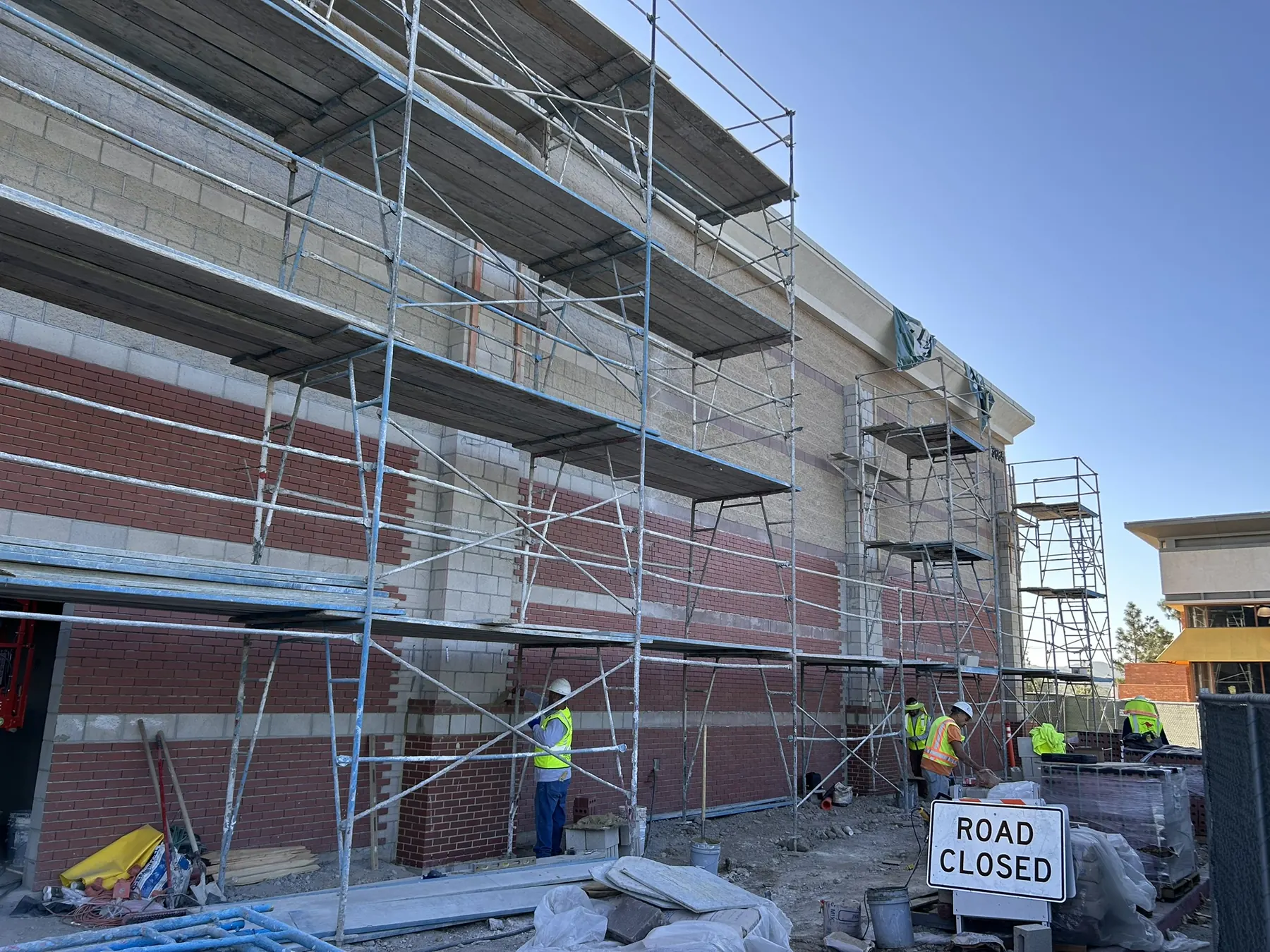 Scaffolding along a brick and block commercial building under construction